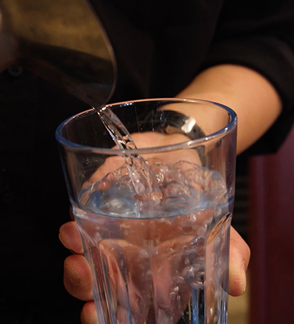 Water pouring into a glass