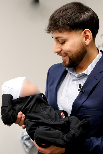 Officer holding baby he saved