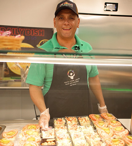 CCSD worker serving food