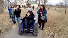 little boy riding track chair