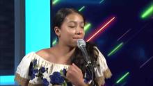 Young hispanic woman singing in Spanish