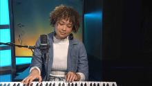 Young Woman Singing and Playing Piano
