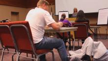 Man sits in Aurora Public library