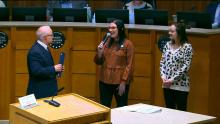 Mayor addressing two women at City Council 