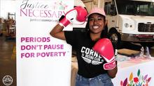 Woman with boxing gloves smiling