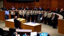 Group of people in the Aurora City Council Chamber