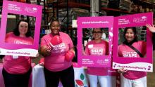 Women in pink smiling