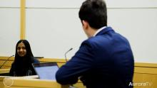 Two teens recreating a case during a mock trial of teen court