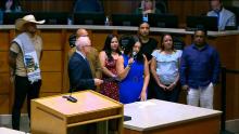 Group standing together in the Aurora City Council Chamber that links to the July 8 2024 City Council meeeting.