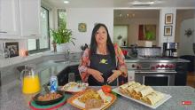 Lindita next to breakfast burritos