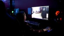 Kid playing video games at esports hub