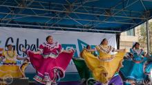 Women dancing in colorful dresses