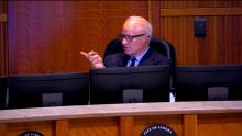 Mayor Mike Coffman speaking during an Aurora City Council Meeting