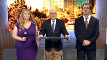 Mayor Mike Coffman presenting proclamation in AuroraTV studio