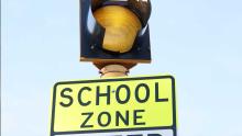 Flashing light on school zone sign