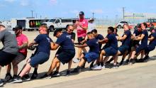 APD officers pull the plane during the challenge