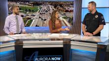 Anchors talking to Aurora Police officer