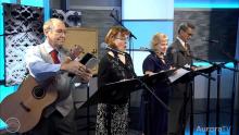 Four people performing the radio play