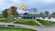 Aurora Hills clubhouse with logo above the roof