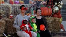 Family takes a photo at Fall into Fun