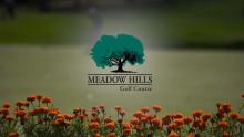 Meadow Hills logo above a bed of flowers