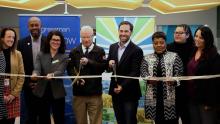 City council, Mayor Coffman, and Jason Crow cutting a ribbon