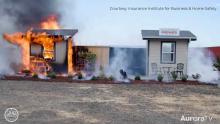two fire demonstration homes, one burning the other one not burninging