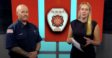 Eric Hurst and Miranda Christian in AuroraTV studio with AFR logo in background monitor