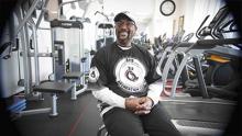 Keithan Holiday, owner of Sebs Recreation Center, smiling during interview