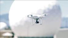 Drone flying in front of a radome