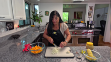 Lindita cutting up ingredients