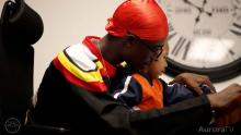 SAVE program participant holding child